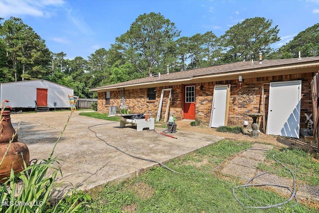 428 Simpson Cir, Mendenhall, MS 39114 - rear view of property with a patio area and brick siding