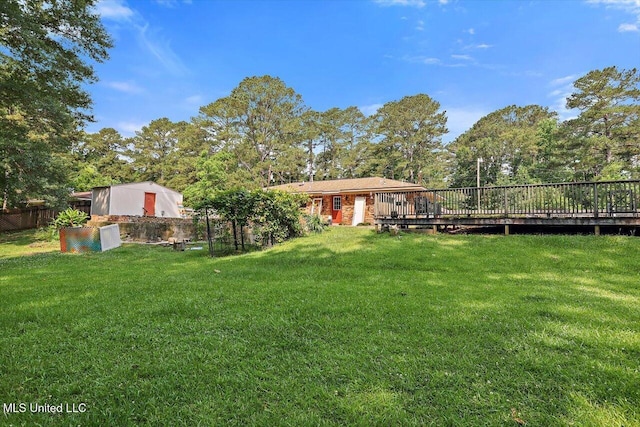 428 Simpson Cir, Mendenhall, MS 39114 - view of yard featuring a deck and view of scattered trees