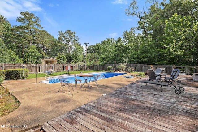 428 Simpson Cir, Mendenhall, MS 39114 - view of pool featuring a deck, a fenced backyard, and view of scattered trees
