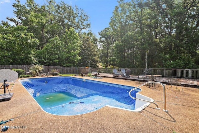 428 Simpson Cir, Mendenhall, MS 39114 - view of swimming pool with a fenced backyard, a patio area, and view of wooded area