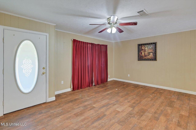 428 Simpson Cir, Mendenhall, MS 39114 - entrance foyer featuring ceiling fan, wood finished floors, ornamental molding, baseboards, and a textured ceiling