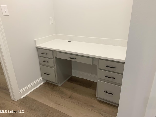 10229 Patrick Dr, Gulfport, MS 39503 - bathroom with baseboards, wood finished floors, and vanity