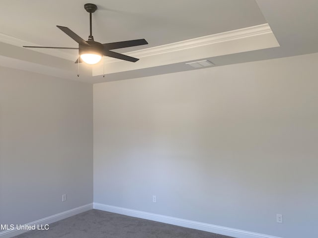 10229 Patrick Dr, Gulfport, MS 39503 - spare room with baseboards, ornamental molding, dark colored carpet, visible vents, and ceiling fan