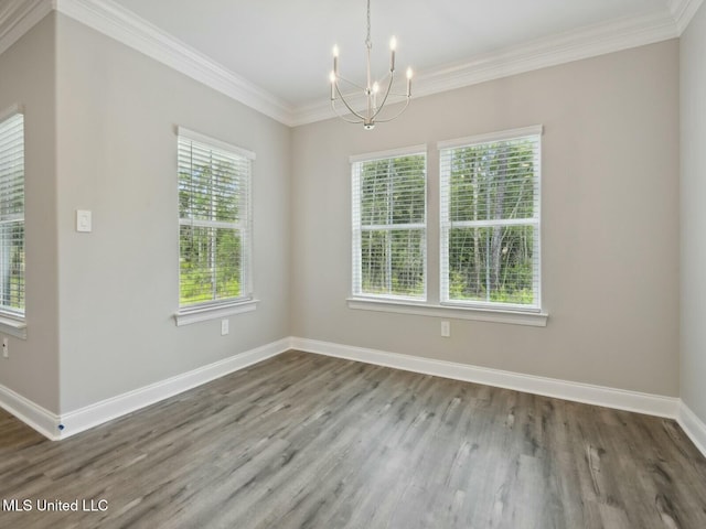 10507 Glade Cv, Gulfport, MS 39503 - unfurnished dining area with ornamental molding, a notable chandelier, wood finished floors, and baseboards