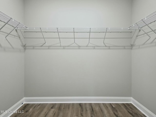 10507 Glade Cv, Gulfport, MS 39503 - walk in closet with dark wood-type flooring