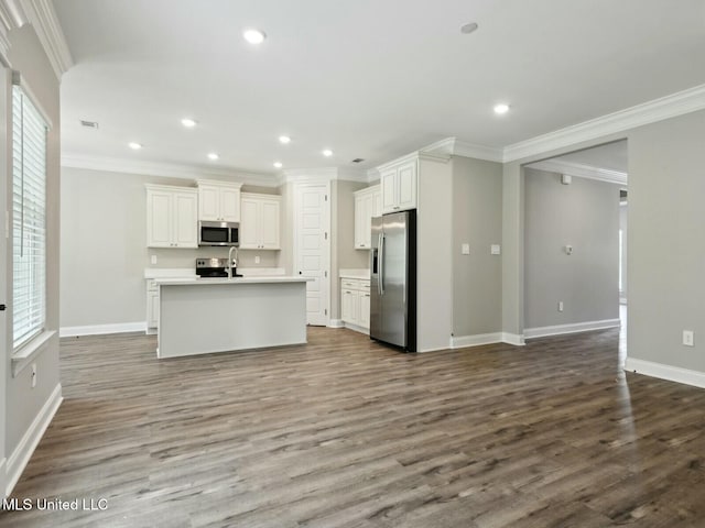 10507 Glade Cv, Gulfport, MS 39503 - kitchen with dark wood-style flooring, white cabinetry, stainless steel appliances, and baseboards