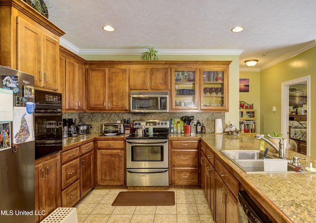 102 Grand Bear Cir, Vicksburg, MS 39183 - kitchen featuring light tile patterned floors, ornamental molding, a sink, decorative backsplash, and black appliances