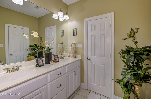 102 Grand Bear Cir, Vicksburg, MS 39183 - bathroom with double vanity, tile patterned floors, visible vents, and a sink