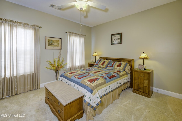 102 Grand Bear Cir, Vicksburg, MS 39183 - bedroom featuring baseboards, ceiling fan, light carpet, and visible vents