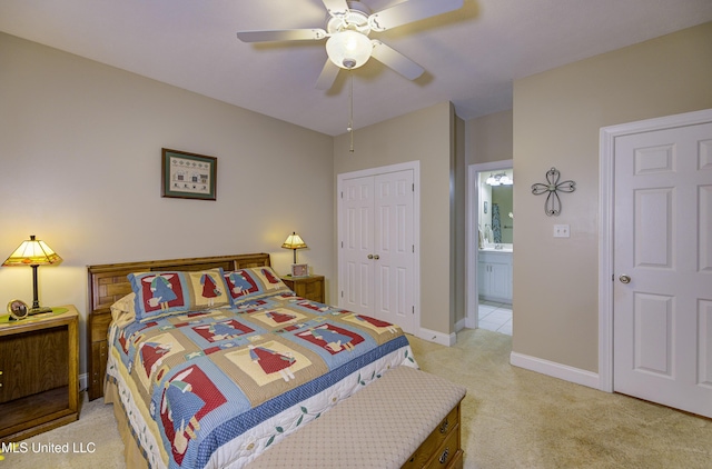102 Grand Bear Cir, Vicksburg, MS 39183 - bedroom featuring a ceiling fan, a closet, baseboards, ensuite bath, and light carpet