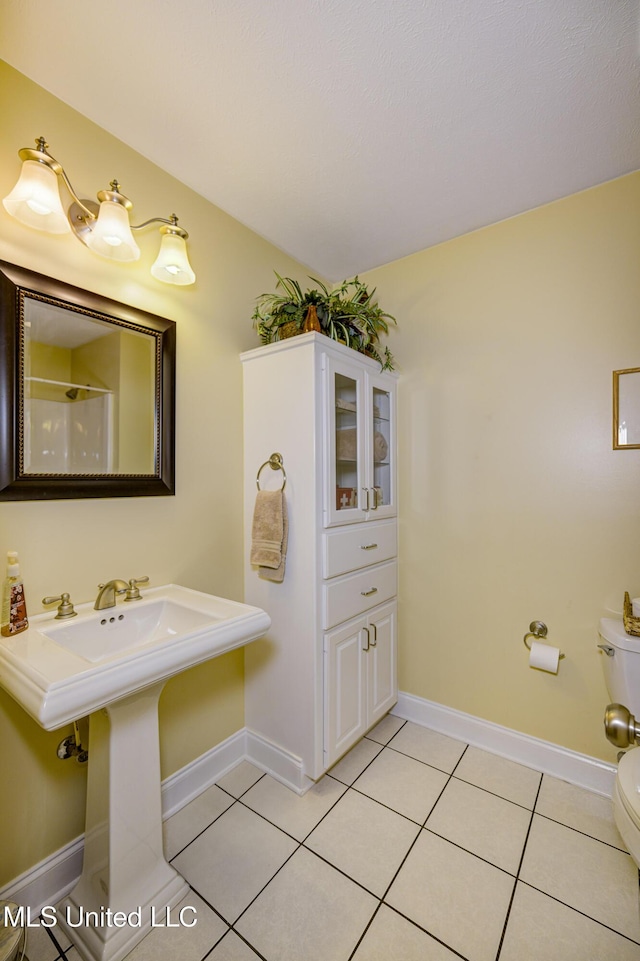 102 Grand Bear Cir, Vicksburg, MS 39183 - bathroom with toilet, baseboards, and tile patterned floors
