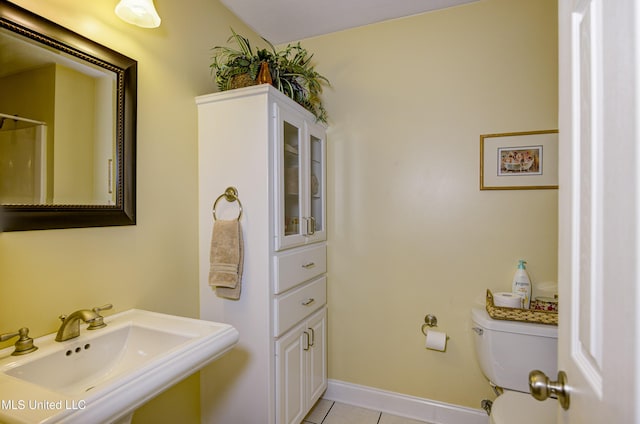102 Grand Bear Cir, Vicksburg, MS 39183 - bathroom with tile patterned floors, toilet, baseboards, and a sink