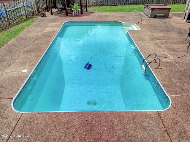 102 Grand Bear Cir, Vicksburg, MS 39183 - view of pool with a fenced backyard, a patio, a fenced in pool, and a hot tub