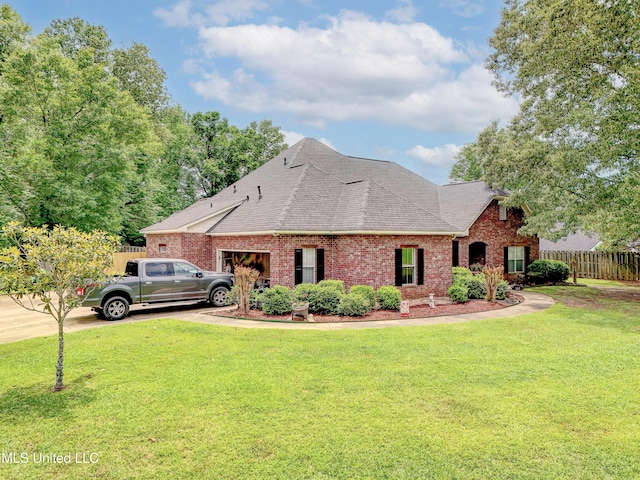 102 Grand Bear Cir, Vicksburg, MS 39183 - view of front of property featuring a shingled roof, brick siding, fence, and a garage