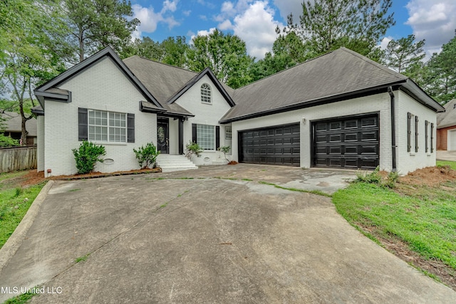 105 Lilac Ct, Madison, MS 39110 - view of front facade featuring brick siding, concrete driveway, an attached garage, and a shingled roof