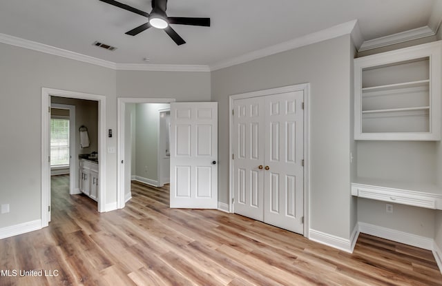 105 Lilac Ct, Madison, MS 39110 - unfurnished bedroom featuring crown molding, light wood finished floors, a closet, and ceiling fan