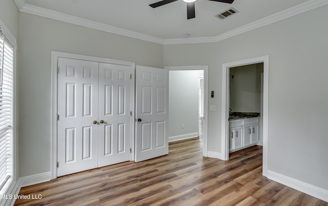 105 Lilac Ct, Madison, MS 39110 - unfurnished bedroom with crown molding, wood finished floors, a closet, ceiling fan, and ensuite bathroom