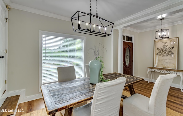 105 Lilac Ct, Madison, MS 39110 - dining room with a chandelier, wood finished floors, ornate columns, and crown molding