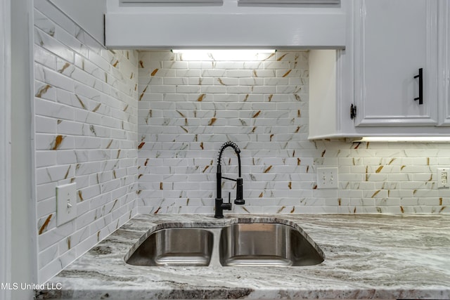 105 Lilac Ct, Madison, MS 39110 - kitchen with decorative backsplash, white cabinets, and light stone counters