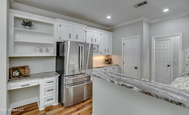 105 Lilac Ct, Madison, MS 39110 - kitchen featuring freestanding refrigerator, open shelves, white cabinets, ornamental molding, and light wood-type flooring