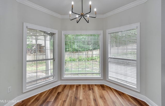 105 Lilac Ct, Madison, MS 39110 - unfurnished dining area with a chandelier, plenty of natural light, ornamental molding, and wood finished floors