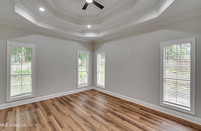 105 Lilac Ct, Madison, MS 39110 - spare room featuring plenty of natural light, a raised ceiling, ceiling fan, wood finished floors, and crown molding