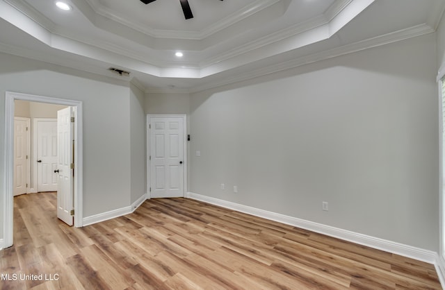 105 Lilac Ct, Madison, MS 39110 - empty room with light wood-style flooring, ceiling fan, crown molding, a raised ceiling, and recessed lighting