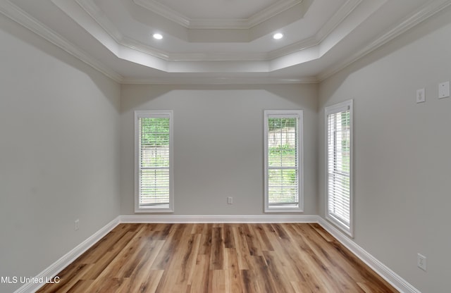 105 Lilac Ct, Madison, MS 39110 - empty room with light wood finished floors, a raised ceiling, ornamental molding, and recessed lighting