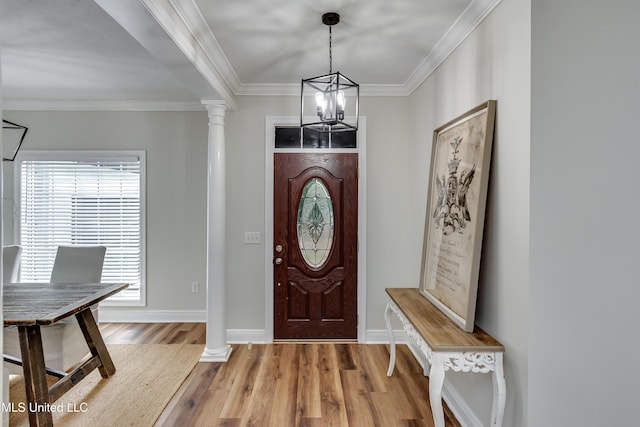105 Lilac Ct, Madison, MS 39110 - foyer with a chandelier, decorative columns, wood finished floors, and crown molding