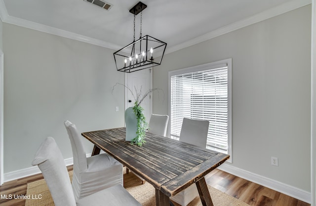 105 Lilac Ct, Madison, MS 39110 - dining room featuring a chandelier, crown molding, healthy amount of natural light, and wood finished floors