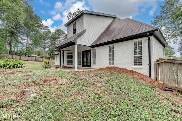 105 Lilac Ct, Madison, MS 39110 - rear view of house featuring roof with shingles, brick siding, a patio area, and french doors