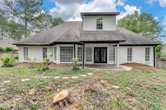 105 Lilac Ct, Madison, MS 39110 - back of property with brick siding, french doors, a patio area, and roof with shingles
