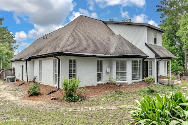 105 Lilac Ct, Madison, MS 39110 - rear view of property with a shingled roof and brick siding