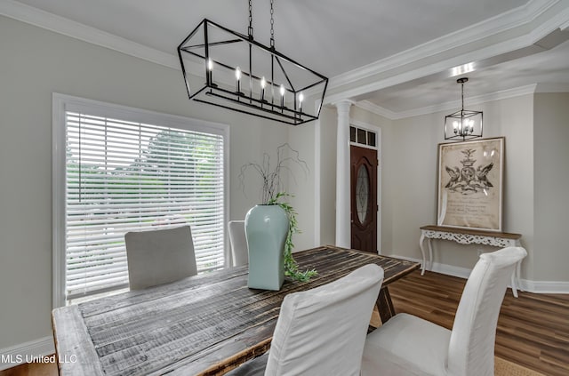 105 Lilac Ct, Madison, MS 39110 - dining area featuring a chandelier, crown molding, wood finished floors, and ornate columns