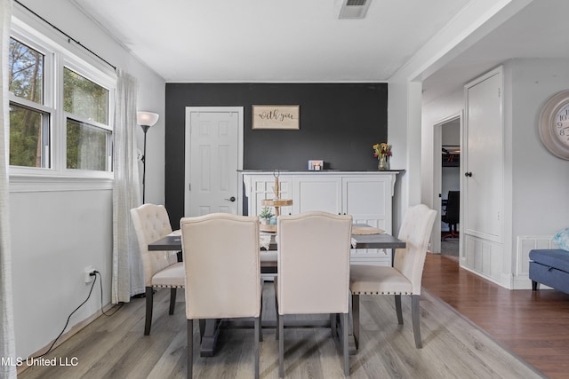 dining space featuring hardwood / wood-style floors