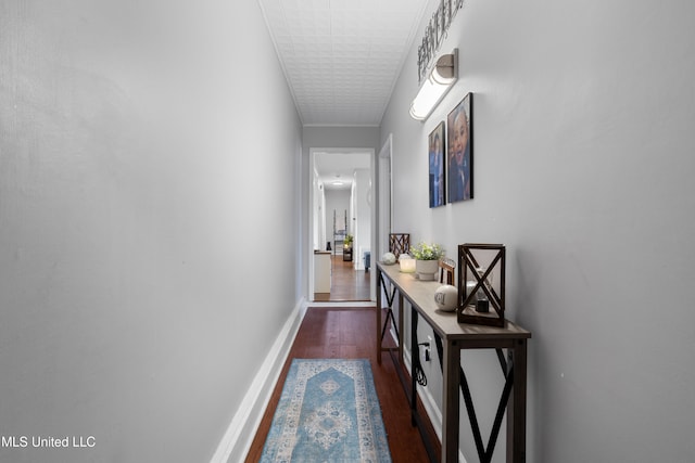 hallway with dark hardwood / wood-style floors