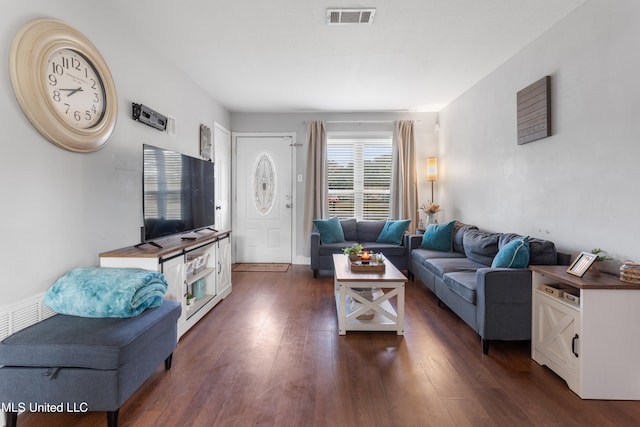 living room featuring dark wood-type flooring