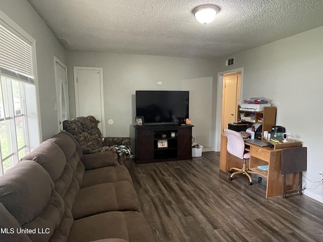 office area with a textured ceiling and dark hardwood / wood-style flooring