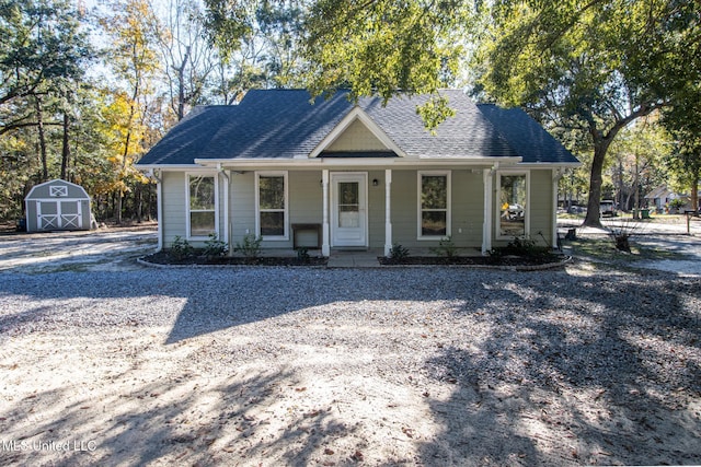 view of front of property featuring a storage unit