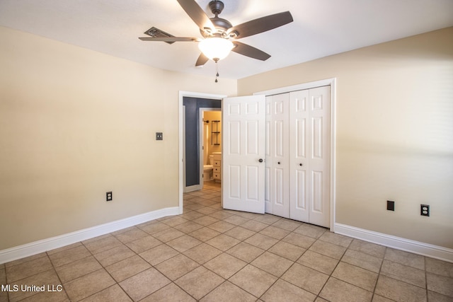 unfurnished bedroom featuring ceiling fan and a closet