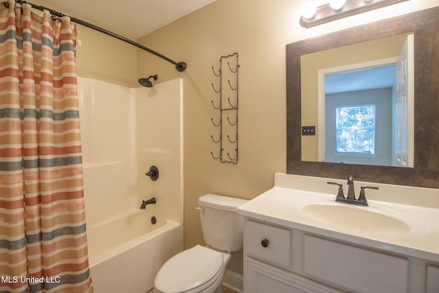 full bathroom with shower / tub combo with curtain, vanity, and toilet