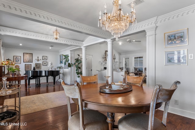 dining room featuring crown molding, ceiling fan, ornate columns, and dark hardwood / wood-style flooring