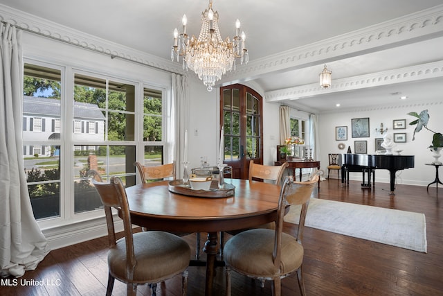 dining area with ornamental molding, a notable chandelier, and dark hardwood / wood-style floors