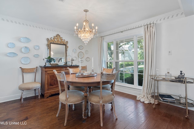 dining room featuring ornamental molding, a chandelier, and dark hardwood / wood-style flooring