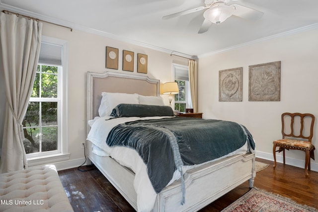 bedroom featuring ornamental molding, dark wood-type flooring, and ceiling fan