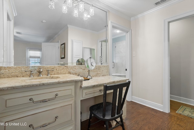 bathroom featuring vanity, hardwood / wood-style floors, and crown molding