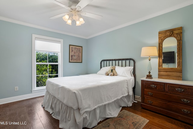 bedroom with crown molding, dark hardwood / wood-style floors, and ceiling fan