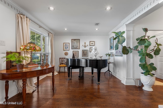 miscellaneous room with ornamental molding, decorative columns, and dark wood-type flooring