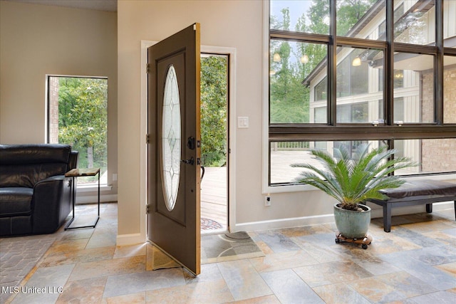 6821 Autumn Oaks Dr, Olive Branch, MS 38654 - entryway with baseboards and stone tile floors