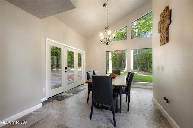 6821 Autumn Oaks Dr, Olive Branch, MS 38654 - dining space featuring french doors, baseboards, healthy amount of natural light, a chandelier, and high vaulted ceiling